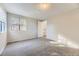 Carpeted bedroom featuring natural light and a closet at 5749 S Lansing Way, Englewood, CO 80111