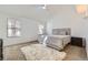 Bright bedroom featuring two windows, a ceiling fan, and soft, neutral decor at 5749 S Lansing Way, Englewood, CO 80111