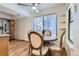 Cozy dining area featuring a round table, wooden chairs, and a large window at 5749 S Lansing Way, Englewood, CO 80111