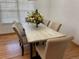 Formal dining room features a modern chandelier, hardwood floors, and stylish seating for elegant gatherings at 5749 S Lansing Way, Englewood, CO 80111