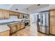 Spacious kitchen with stainless steel appliances and wood cabinets at 5749 S Lansing Way, Englewood, CO 80111