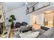 Open living area with vaulted ceilings, a stone fireplace, and lots of natural light at 5749 S Lansing Way, Englewood, CO 80111