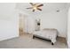 Spacious bedroom offers neutral walls, carpet, ceiling fan, and ensuite bathroom access at 2502 S Bahama Cir # B, Aurora, CO 80013