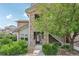 Charming townhome exterior with stone facade, landscaped yard, and welcoming entrance at 2502 S Bahama Cir # B, Aurora, CO 80013