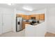 Functional kitchen featuring stainless steel appliances and ample cabinet space at 2502 S Bahama Cir # B, Aurora, CO 80013