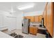 Bright kitchen featuring stainless steel appliances, functional layout, and modern conveniences at 2502 S Bahama Cir # B, Aurora, CO 80013
