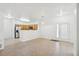 Open living space featuring tile floors, bright light, and easy kitchen access at 2502 S Bahama Cir # B, Aurora, CO 80013