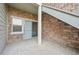 Covered patio with stone accents and sliding glass door at 2502 S Bahama Cir # B, Aurora, CO 80013