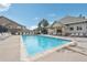 Community pool with lounge chairs and a seating area at 2502 S Bahama Cir # B, Aurora, CO 80013
