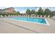 Large community swimming pool with plenty of lounge chairs at 2502 S Bahama Cir # B, Aurora, CO 80013