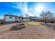 Bright backyard featuring a deck, fire pit area, and rock landscaping that provides low maintenance appeal at 16555 E Wesley Ave, Aurora, CO 80013