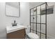 Modern bathroom featuring wood vanity and glass enclosed shower at 16555 E Wesley Ave, Aurora, CO 80013