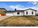 Charming single-story home featuring white siding, a black roof, and a well-manicured front yard at 16555 E Wesley Ave, Aurora, CO 80013