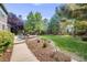 Relaxing backyard with patio, fire pit, and lush landscaping at 1274 Meyerwood Ln, Highlands Ranch, CO 80129