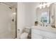 Bright bathroom features a glass shower and sleek white vanity at 1274 Meyerwood Ln, Highlands Ranch, CO 80129