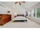 Bright primary bedroom with vaulted ceilings, neutral carpet, and large windows at 1274 Meyerwood Ln, Highlands Ranch, CO 80129