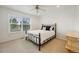 Cozy bedroom features a large window and neutral carpet at 1274 Meyerwood Ln, Highlands Ranch, CO 80129