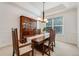 Well-lit dining room with wooden table, chairs, and hutch at 1274 Meyerwood Ln, Highlands Ranch, CO 80129