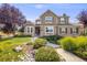 Charming two-story home with brick and siding exterior, landscaped front yard, and a welcoming walkway at 1274 Meyerwood Ln, Highlands Ranch, CO 80129