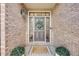 Close-up of the elegant front door featuring sidelights, a wreath, and a welcoming mat at 1274 Meyerwood Ln, Highlands Ranch, CO 80129