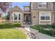 Inviting front entrance with a stylish front door, brick accents, and a well-maintained walkway at 1274 Meyerwood Ln, Highlands Ranch, CO 80129