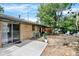 Mature landscaping and a concrete patio provide a relaxing outdoor space at 400 S Hoyt St, Lakewood, CO 80226