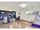 Spacious finished basement featuring a fireplace, play area, and comfortable seating at 400 S Hoyt St, Lakewood, CO 80226