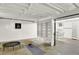 Unfinished basement featuring a trampoline, yoga mat, and exposed ceiling at 400 S Hoyt St, Lakewood, CO 80226
