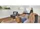 Cozy finished basement featuring wood-look floors, playful teepee, and natural light from two windows at 400 S Hoyt St, Lakewood, CO 80226