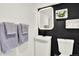 Stylish bathroom featuring modern fixtures, dark accent wall, and decorative towel racks at 400 S Hoyt St, Lakewood, CO 80226
