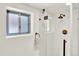 Modern bathroom with walk-in shower, white subway tile, and bronze fixtures at 400 S Hoyt St, Lakewood, CO 80226