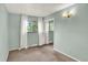 Bedroom featuring a window, neutral carpet, and a closet at 400 S Hoyt St, Lakewood, CO 80226