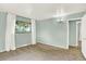 Bedroom featuring a window, an accent wall color, and a doorway to another room at 400 S Hoyt St, Lakewood, CO 80226