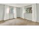 Bright bedroom with plush carpeting, two large windows, neutral walls, and plenty of natural light at 400 S Hoyt St, Lakewood, CO 80226