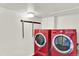Well-lit laundry room featuring a washer and dryer set at 400 S Hoyt St, Lakewood, CO 80226