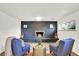 Cozy living room featuring a stylish brick fireplace and comfortable seating area at 400 S Hoyt St, Lakewood, CO 80226