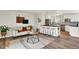 Open-concept living room featuring a breakfast bar with seating and a cozy seating area at 400 S Hoyt St, Lakewood, CO 80226