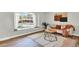 Bright living room with large window and neutral decor and hardwood style floors at 400 S Hoyt St, Lakewood, CO 80226