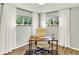 Bright home office with a modern desk, chair, stylish rug, and dual windows providing natural light at 400 S Hoyt St, Lakewood, CO 80226