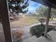 Landscaped backyard with rock wall and neighboring homes at 7101 W Yale Ave # 1206, Denver, CO 80227