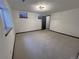 Spacious basement area with carpet and natural light from a window at 7101 W Yale Ave # 1206, Denver, CO 80227