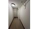 Finished basement closet with shelving and carpeting at 7101 W Yale Ave # 1206, Denver, CO 80227