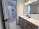 Modern bathroom with walk-in shower and updated vanity at 7101 W Yale Ave # 1206, Denver, CO 80227