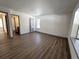 Spacious bedroom with hardwood floors and access to bathroom at 7101 W Yale Ave # 1206, Denver, CO 80227