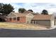 View of multi-Gathering unit with brick and neutral color scheme at 7101 W Yale Ave # 1206, Denver, CO 80227