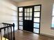 A modern front door with glass panels and black frame welcomes you to this stylish home at 7101 W Yale Ave # 1206, Denver, CO 80227