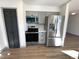 Updated kitchen with stainless steel appliances and gray cabinets at 7101 W Yale Ave # 1206, Denver, CO 80227