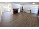 Open concept living room with hardwood floors and fireplace at 7101 W Yale Ave # 1206, Denver, CO 80227