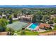 Aerial view of community pool and tennis courts with mountain views at 7101 W Yale Ave # 1206, Denver, CO 80227