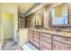 Bathroom with and vanity and sinks, decorative mirrors and a bathtub at 45 Wright Ct, Lakewood, CO 80228